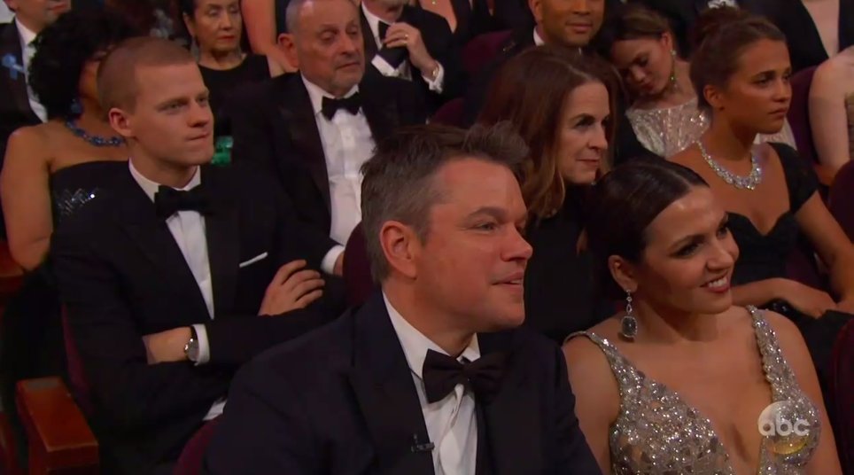 Walldo's tweet photo. Look at Chrissy Teigen back there pretending to sleep through Casey Affleck’s acceptance speech https://t.co/nM7UgQ6Rl9