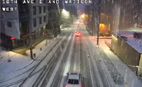 seattledot's tweet image. Snow sticking in many parts of #Seattle and still coming down hard. Please travel safely in these winter weather conditions.