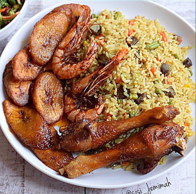afromunch's tweet image. Credit to @sisi_jemimah. Fried rice, barbecue shrimp, fried plantain and chicken. #afromunch #african #caribbean