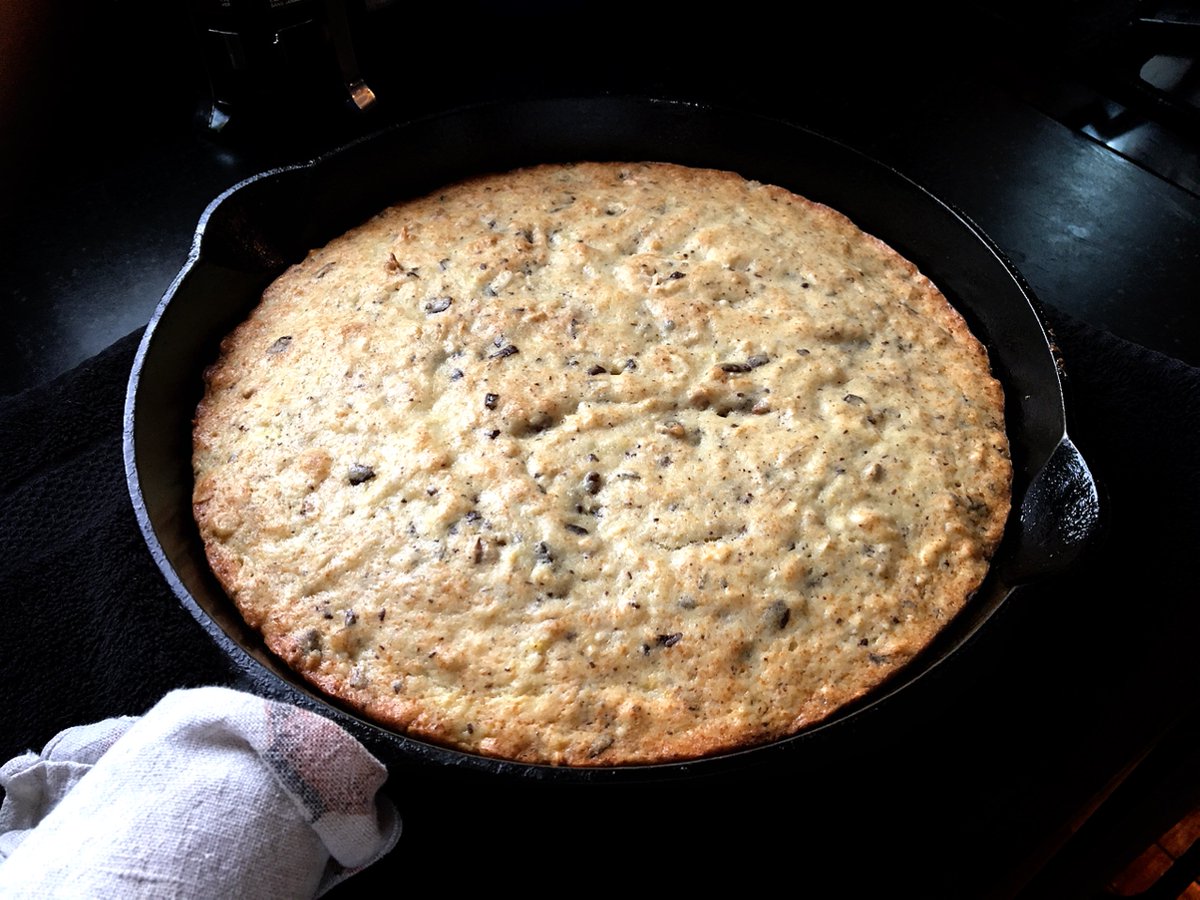 bittman's tweet photo. Turn #HTBE Banana Bread into banana cake: recipe +walnuts+coconut+chocolate. Bake in cast-iron skillet, 35 min. Vanilla ice cream. #cookbitt https://t.co/YiRVYH1SrG