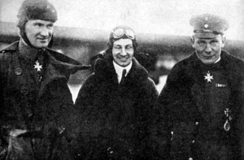 Picture of Hermann Goering in 1915 Bruno Loerzer (Left) Anthony Fokker (Middle) and future Nazi Party leader Hermann Goering (Right) posing for a photograph. Loerzer and Goering wearing their Pour le Mérite medals for personal achievement in aviation combat.