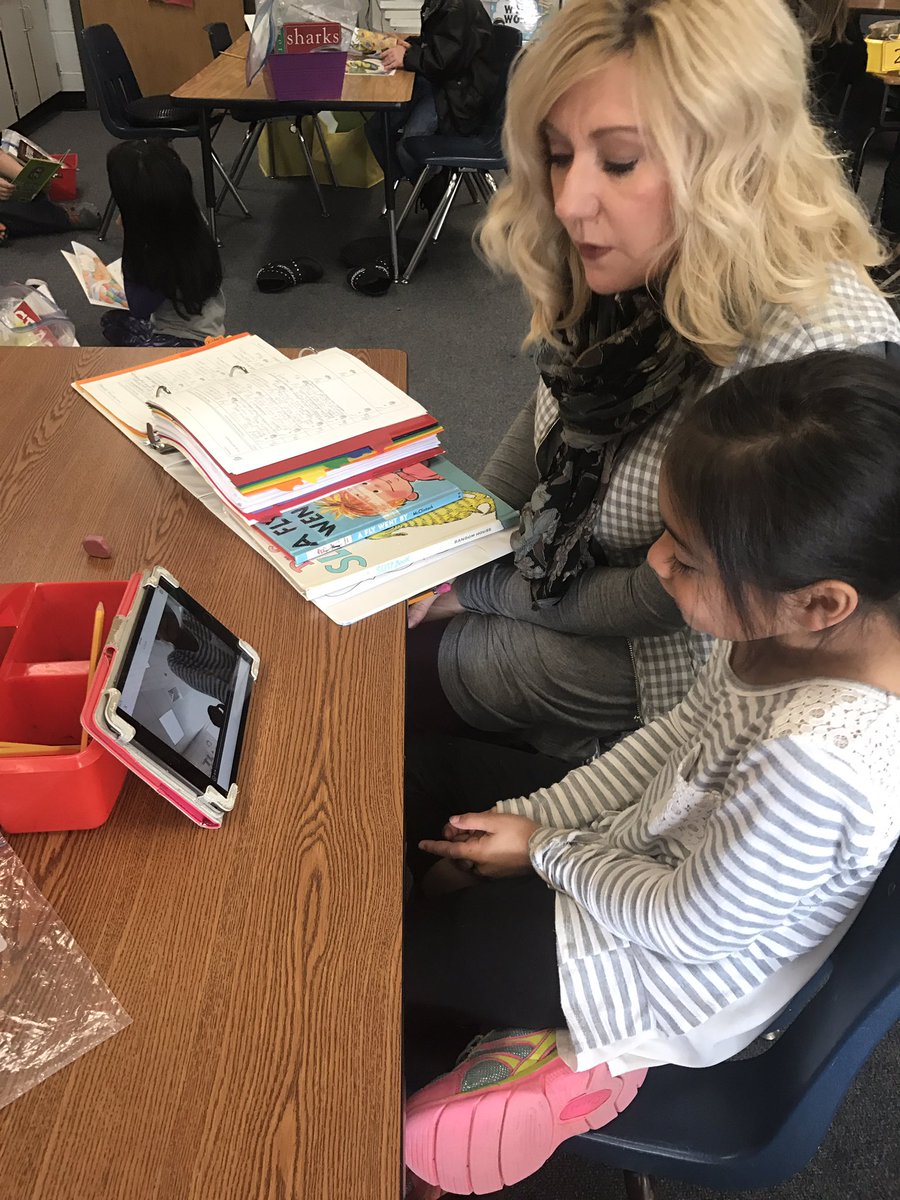 1stgradeSimeone's tweet photo. Mrs. Cato and a student watched their @Seesaw video that she recorded after reading a story. Then they conferred about the book. #besshine https://t.co/cKlkCCxSQ6