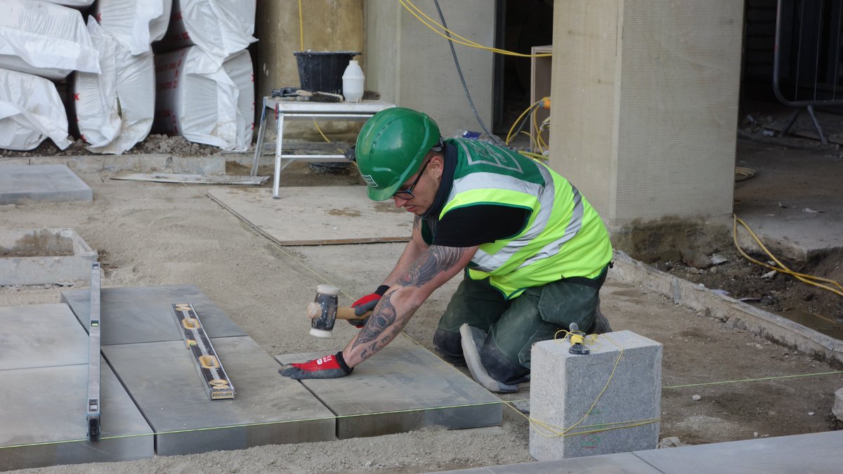 Calderdale's tweet photo. Work continues on @ThePieceHall courtyard as paving stones are laid and a new entrance from the @OrangeBoxHX has been created. See pictures https://t.co/mqs4bTHJfQ