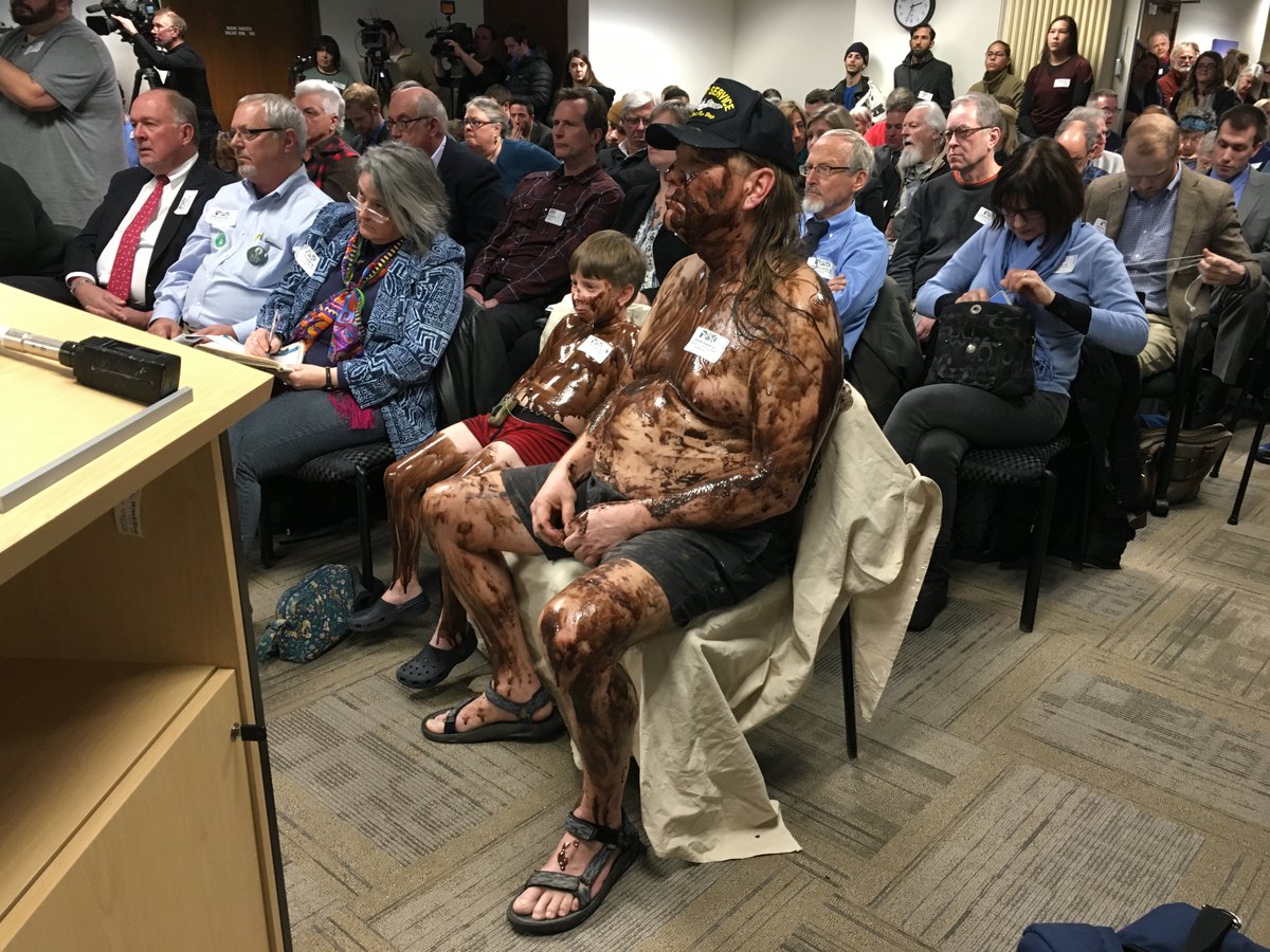 garretellison's tweet image. Protester in front row is Fred Harrington of Petoskey. It's cake batter. Said it would make larger statement than 5 min comment
