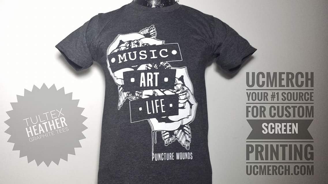White ink on lightweight, #TultexApparel heather graphite tees for <a href="/puncturewounds/">alright</a> awesome! #ucmerch #screenprinting