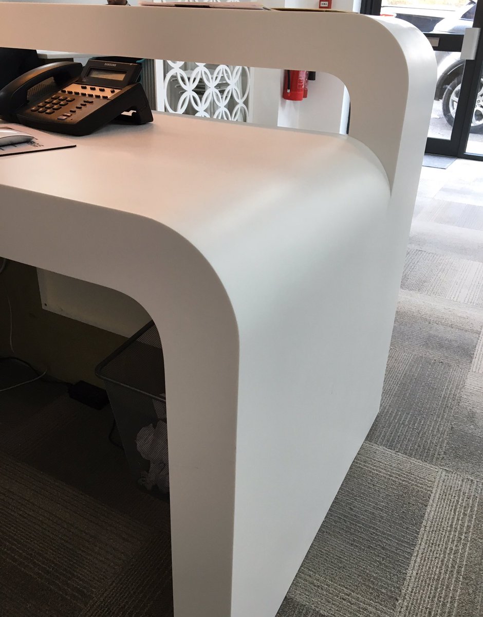 Can't help but still love the seamless joints &amp; finish of DuPont Corian on our reception desk #corian #solidsurface