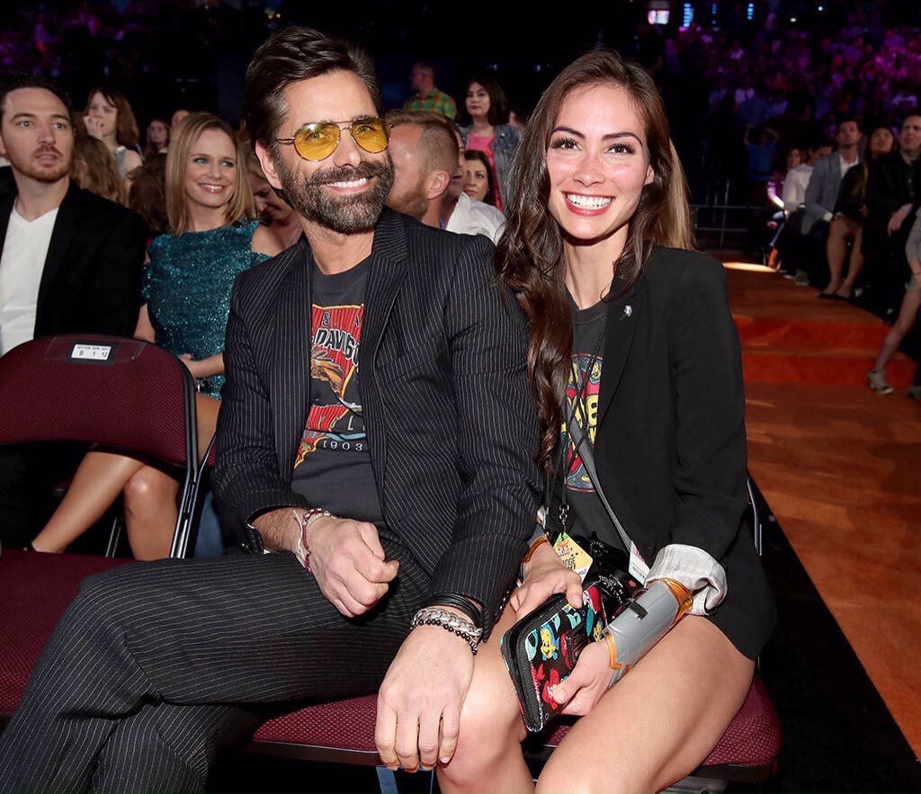 JohnStamosFans1's tweet photo. @JohnStamos with his pretty girlfriend Caitlin McHugh at #KCAs2017. Cute couple. πβ€οΈ (Photos: ETOnline/Getty Images) https://t.co/LqjlfKNZhx