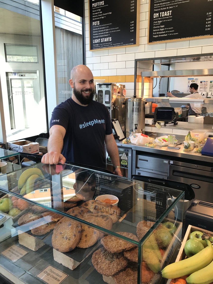 xpqz's tweet photo. Oli rocking some @IBMcloudant  swag behind the bar at local coffee shop @FriskaFood https://t.co/yfIQYt9xoc