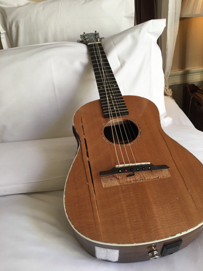 EricIdle's tweet photo. Sod's law.  I bring my travel guitar for the gig, only to fall backwards on it on an escalator at Heathrow!  Oy! https://t.co/TLQ3CVQOvQ