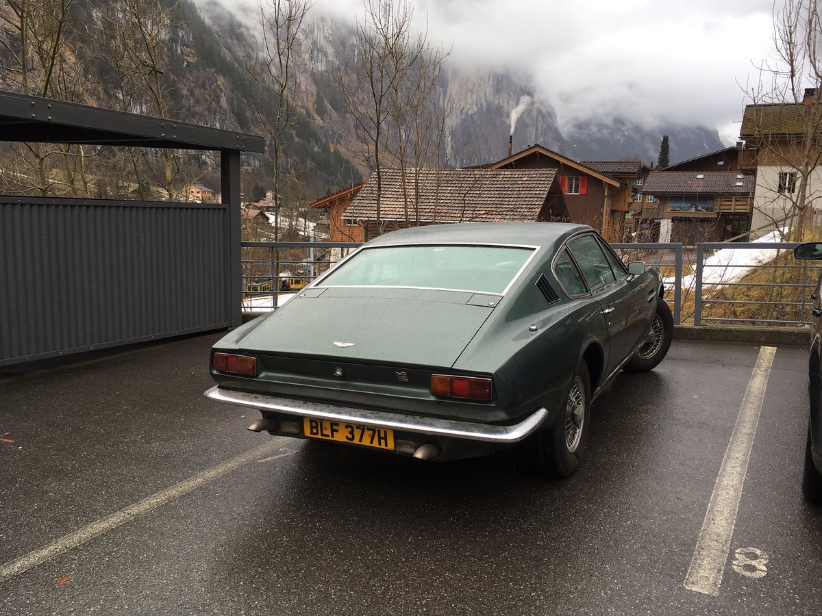 Aston Martin DBS - Bond's car in OHMSS film - in Lauterbrunnen near Interlaken + cable car station up to Piz Gloria