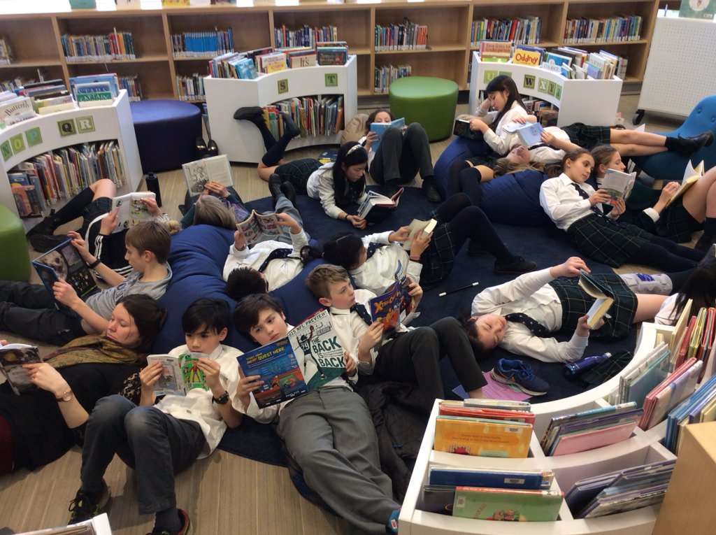 wpgalibrary's tweet image. Reading on the carpet! #randomactsofreading