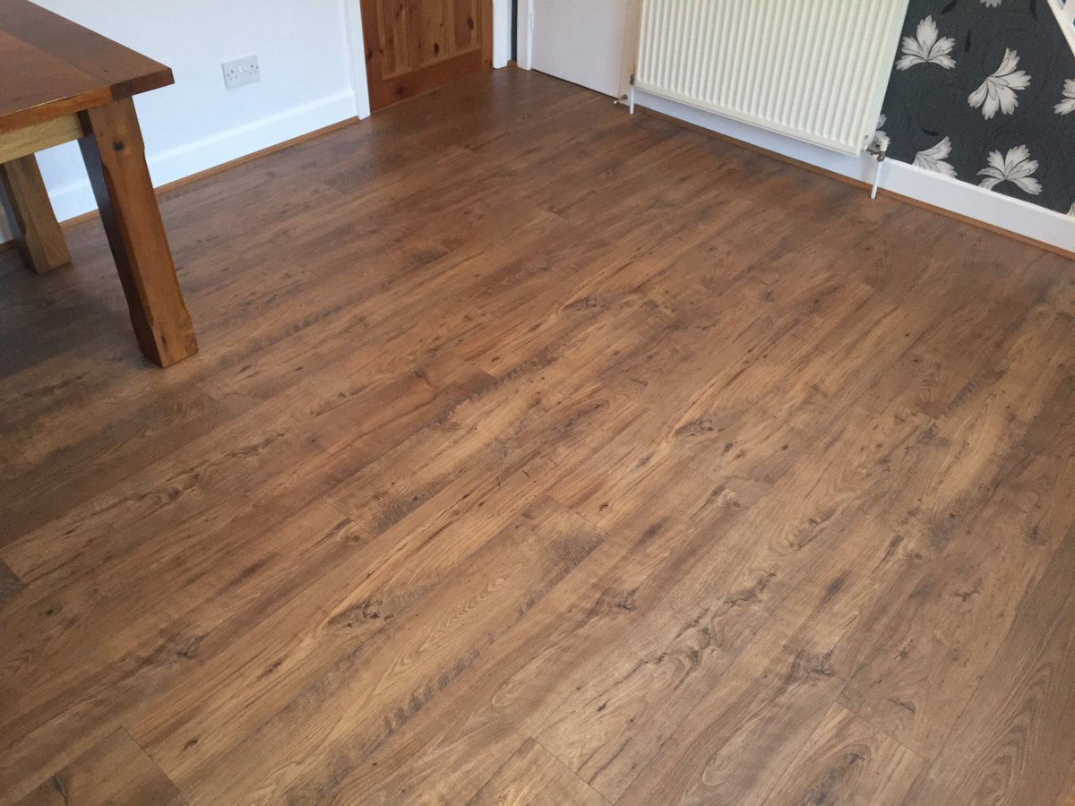 Quickstep eligna wide plank fitted to dining room area #quickstep #flooring #wareham