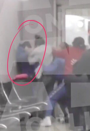 She's is literally on top of chairs pinned against the wall. Wtf?!?