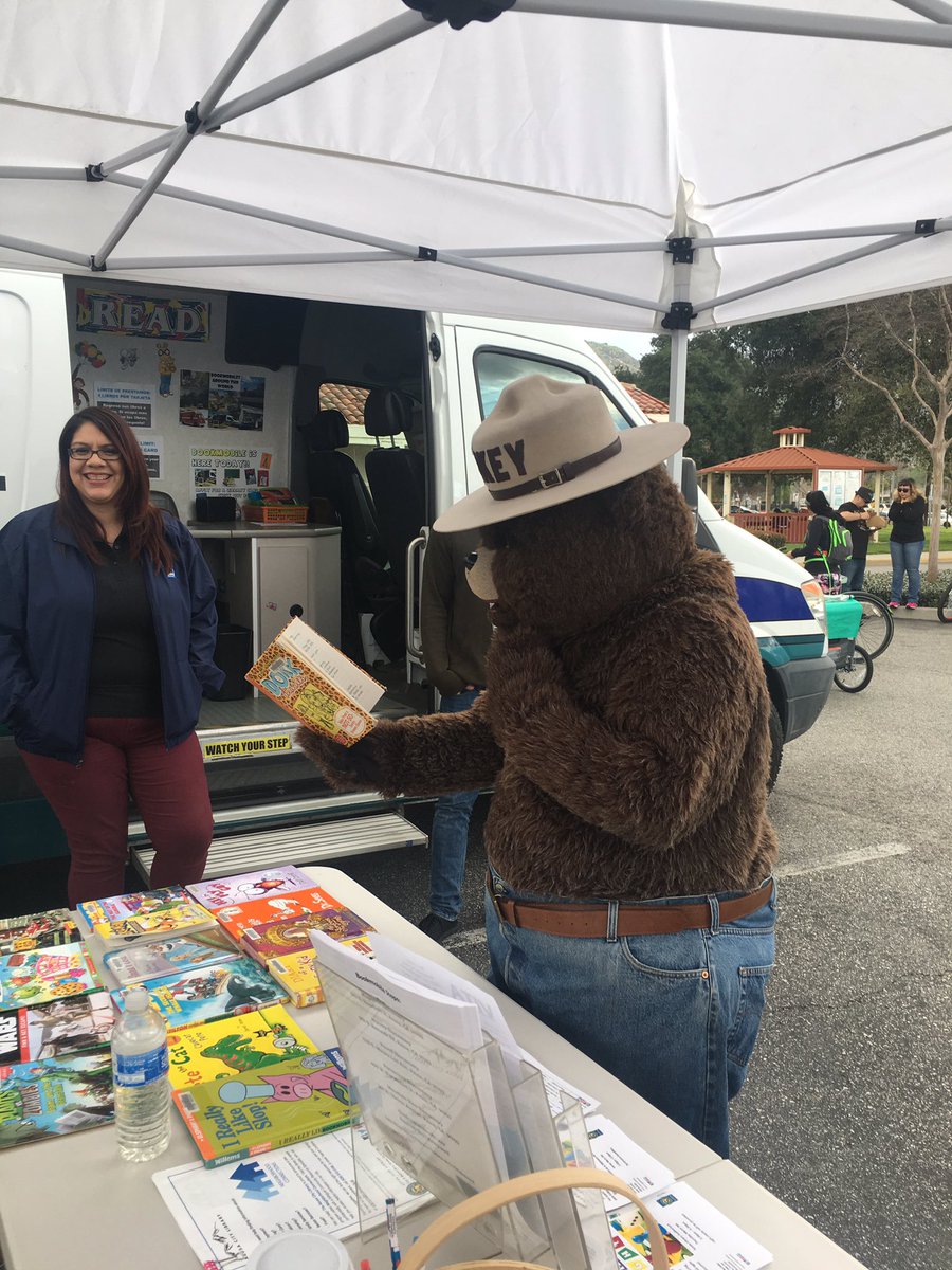 cityofazusa's tweet photo. Smokey visits #azusalibrary bookmobile during #626goldenstreets what's he reading? @Angeles_NF https://t.co/XC3Rb5gFPS