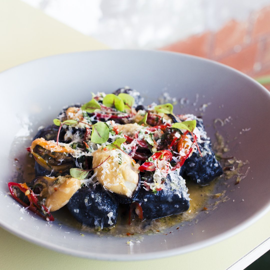 Attention seafood lovers! Feast your eyes on this mouthwatering squid ink ricotta gnocchi with braised mussels and kefalograviera cheese.