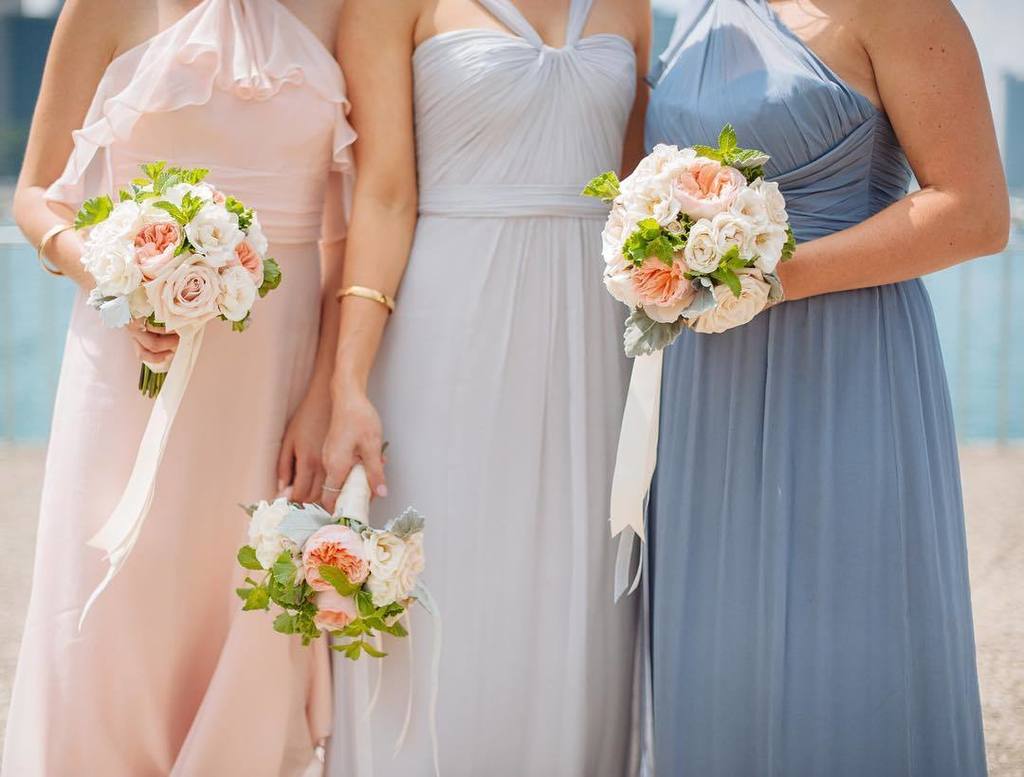 Fresh green, cream, and apricot were the perfect complement to these blush to blue bridesmaid hues. | Floral: @XOHe…