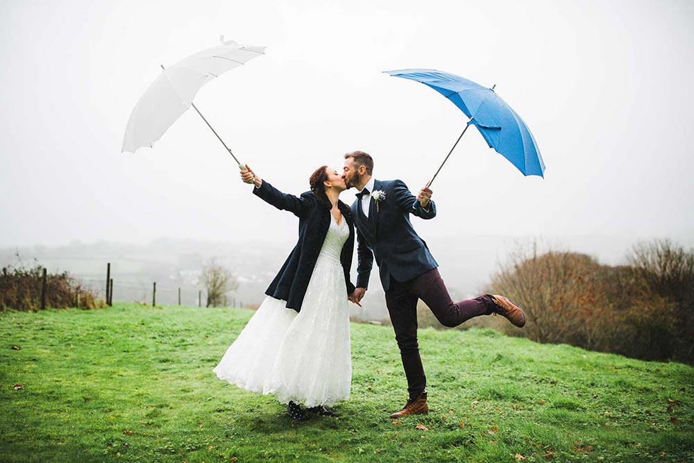 Rain on your #WeddingDay? So what! Newly Weds. Photography <a href="/tobylowe/">Toby Lowe</a> #WeddingVenue @thegreencornwal bit.ly/Toby-Lowe-Phot…