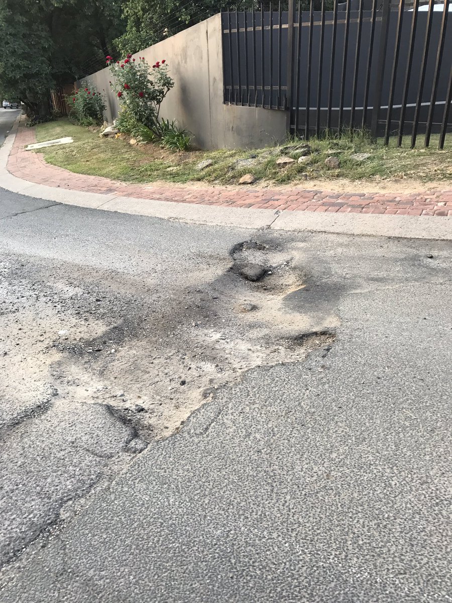 VenterGert's tweet photo. @CityofJoburgZA  can we have this repaired cnr Comrie and Ness Ave Douglasdale. Been here for months now. https://t.co/zYaqUWQzLT