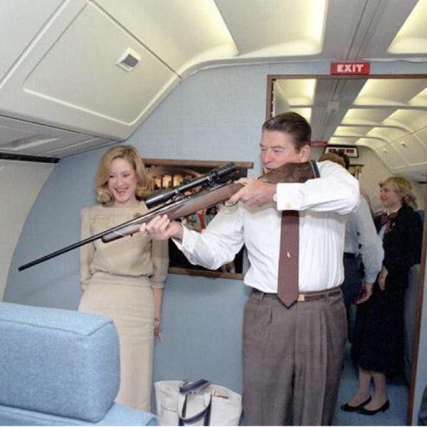 MensHumor's tweet photo. Nothin' says "Merica" like Ronald Reagan with a rifle on Air Force One. https://t.co/yMlHXOoo0B