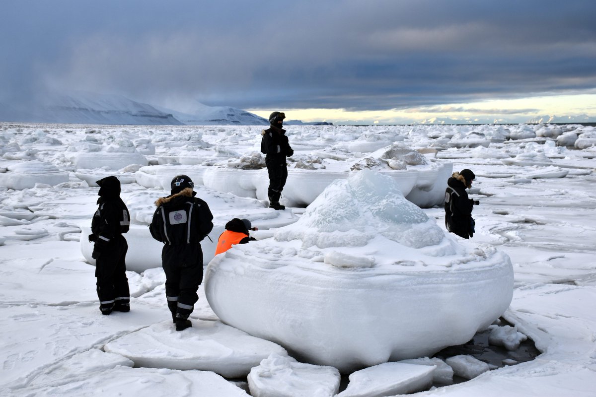 RogueChrisB's tweet photo. #UNISvalbard students explore icebergs from surging #Tunabreen that got incorporated with pancake ice along the shore of Tempelfjorden https://t.co/St3oFHcd1h