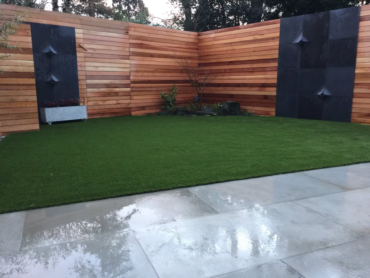 LivingConcrete's tweet photo. Contemporary low maintenance garden using Corner light Storm GRC panels with Mist panels on the patio from Living Concrete https://t.co/WPkoNvEPlj