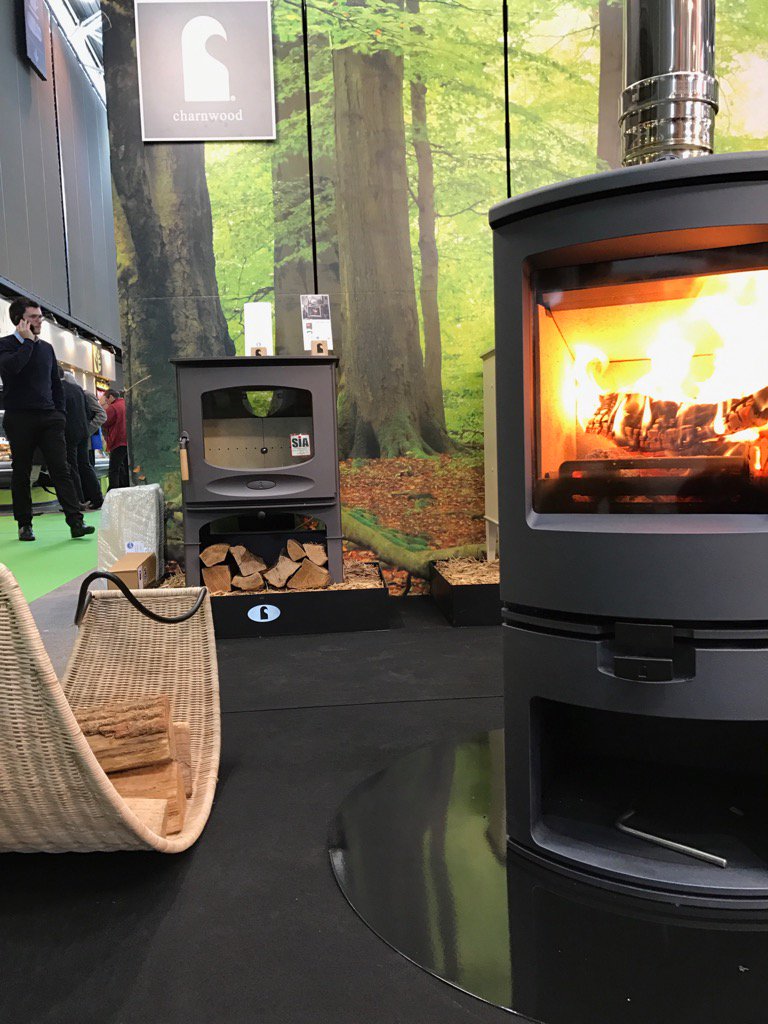 CharnwoodStoves's tweet photo. Our Arc blazing away at  @bepositiveevent on a @vlazesurface hearth fueled with @BodjProducts Lotus #flamexpo https://t.co/qiJzHbNuF4