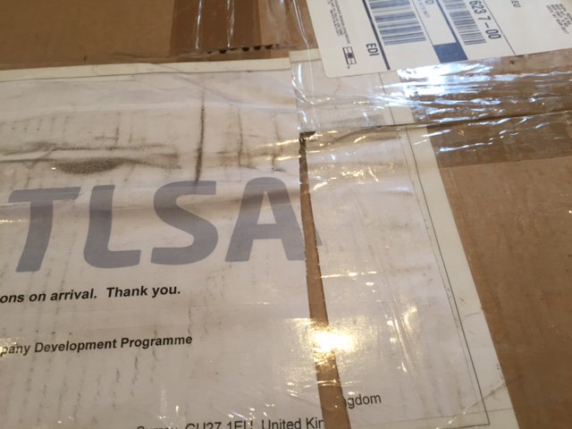 TLSAltd's tweet photo. Unhappy with @UPS atrocious service. Lost label in transit. Returned box in a mess, torn address label, holes in box! Very unhelpful driver. https://t.co/twO4ScXWWV