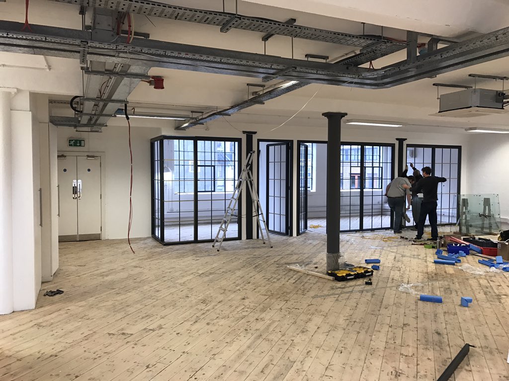 CubedSpace's tweet photo. Bespoke steel framed partitioning by @FormePartitions being installed for our media clients at their new space in The Emerson Building, SE1 https://t.co/SluW9pOwJ4