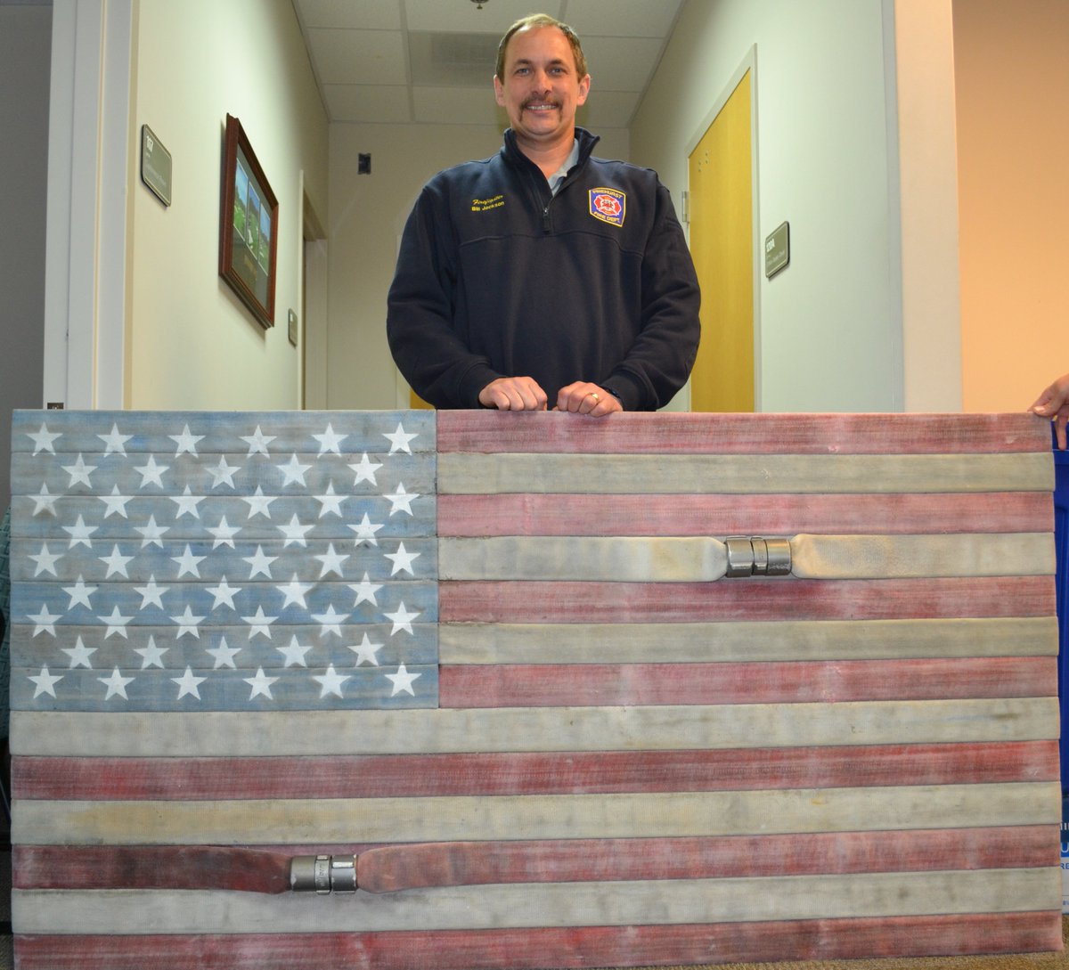 VOPNC's tweet image. Pinehurst Firefighter Bill Jackson created this amazing flag using recycled hoses.
