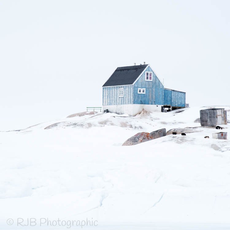 rjbphotographic's tweet photo. A blue house, Oqaatsut, as lovers of minimal images this is what we were hoping to find! 
#greenland #oqaatsut #diskobay #rodebay #Inuit https://t.co/KbY7eaqFqb