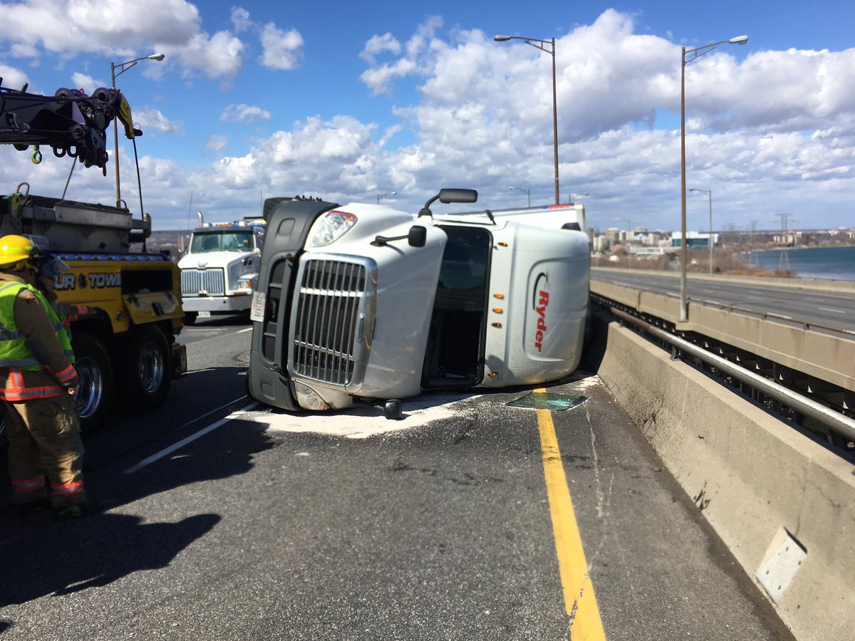 OPP_HSD's tweet photo. Burlington Skyway closed in both directions due to high winds and a rolled over transport truck https://t.co/mmapeKmWDx