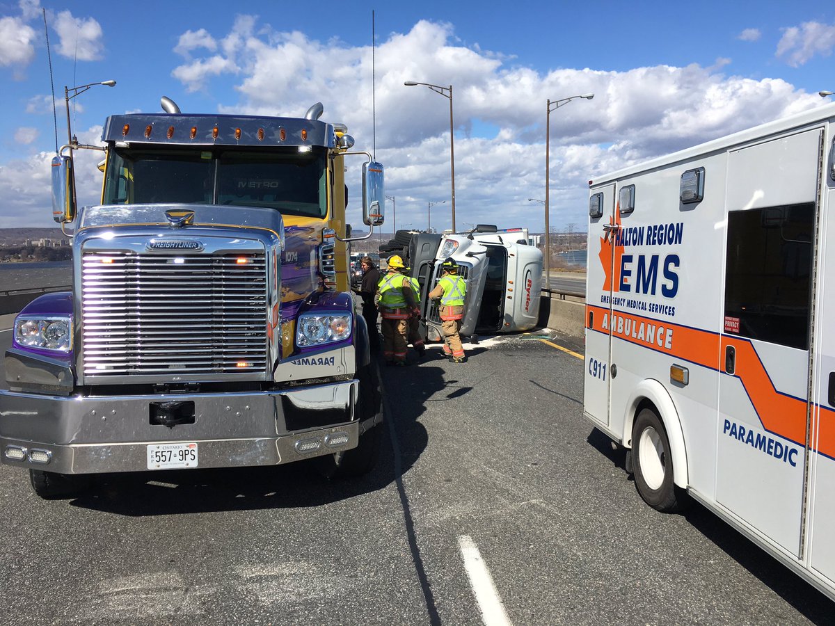 OPP_HSD's tweet photo. Burlington Skyway closed in both directions due to high winds and a rolled over transport truck https://t.co/mmapeKmWDx