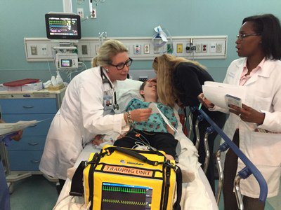 UNCsim's tweet image. Dr @Schadewill as our "mom" w/ her son as our "sick kid" for a #CodeSepsis #UNCsim. #PedsICU #InternationalWomensDay