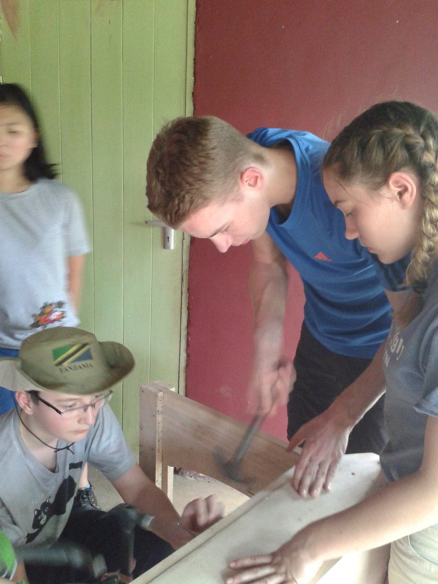 Building student desks for the school