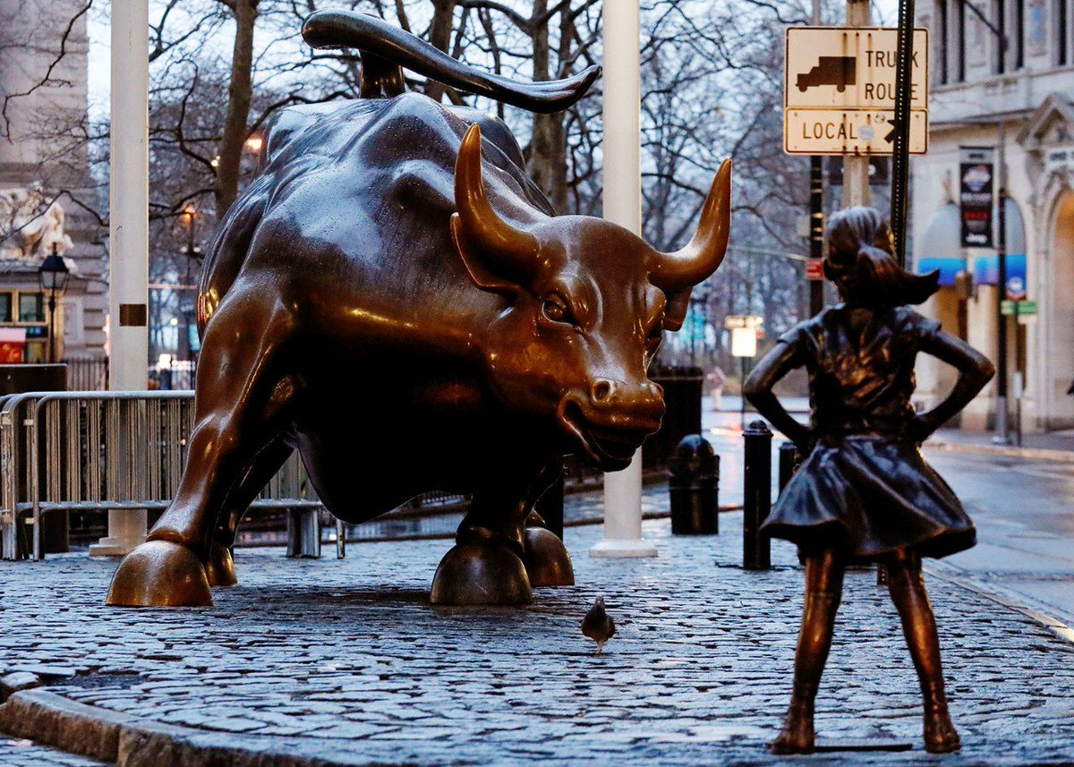 Slate's tweet photo. A bronze little girl is here to face down the Wall Street bull. Good luck, tiny one! https://t.co/xSpnzaojjH https://t.co/yRPAt0xE3b
