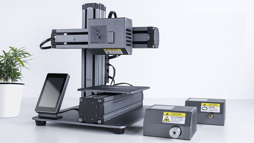 verge's tweet photo. This modular 3D printer can turn into a CNC machine or laser cutter https://t.co/rP7eaBTeQ4 https://t.co/3igyOGkcIo