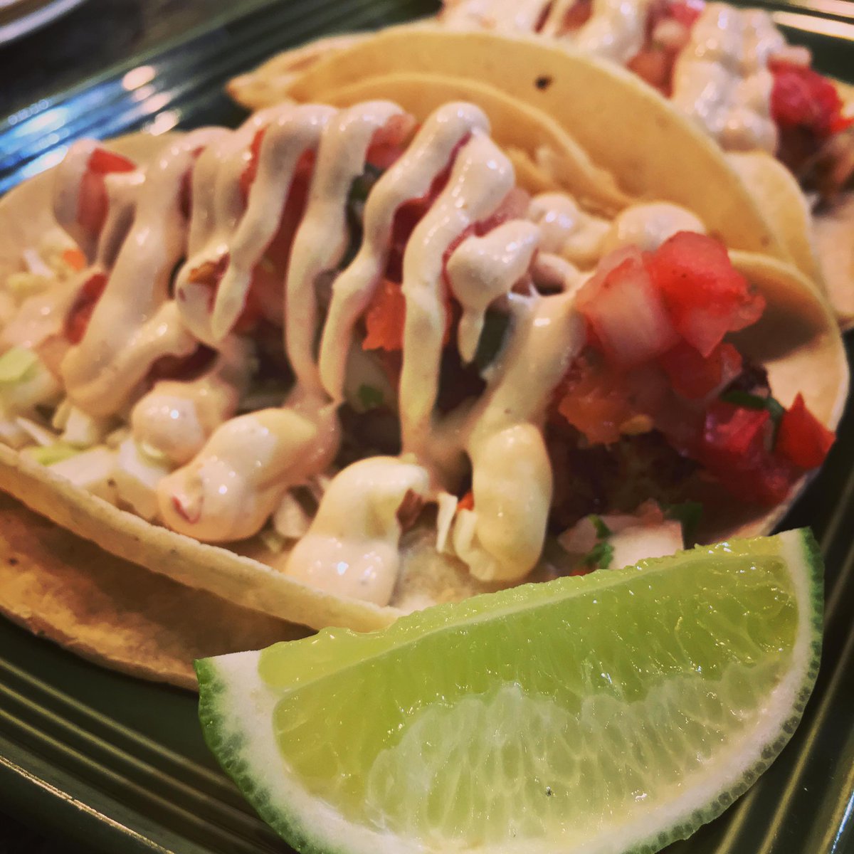 Fish Tacos Lent Special: Cajun spiced Atlantic Haddock with cabbage, pico de gallo, chipotle cream in #GF white corn tortilla #lent #stleats