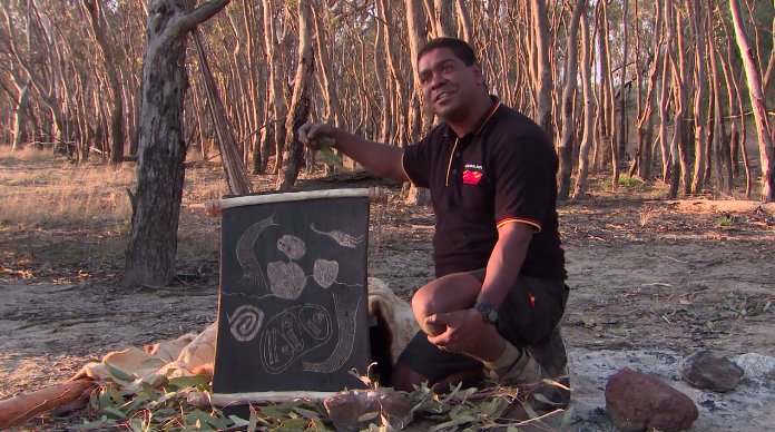 nma's tweet photo. Jida Gulpilil explains the process of making a bark etching on his traditional country in Victoria: https://t.co/SsdoIR2QWb #NMAEncounters https://t.co/OdClQWGW1O