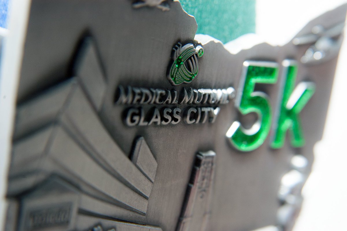 1,750 runners/walkers of all ages and abilities finishing <a href="/medmutual/">Medical Mutual</a> #GlassCity5k get one of these rad. babies. bit.ly/MedicalMutualG…