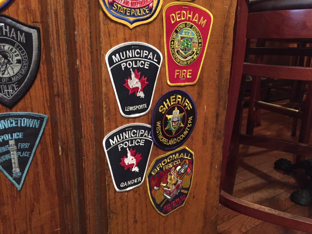 arianakelland's tweet image. Gander police constable Oz Fudge placed a Gander badge, and his son, who is an officer in Lewisporte, pinned his. #ComeFromAway #cbcnl