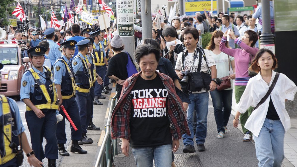 AJEnglish's tweet photo. Japan's anti-racism resistance movement is standing up for Koreans and other ethnic minorities https://t.co/r7DfpxZCAh https://t.co/6ytpoQMSrn