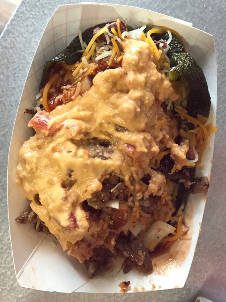 These smoked Poblano Peppers stuffed with chopped Brisket, onions, BBQ sauce, &amp; smothered in queso are awesome!