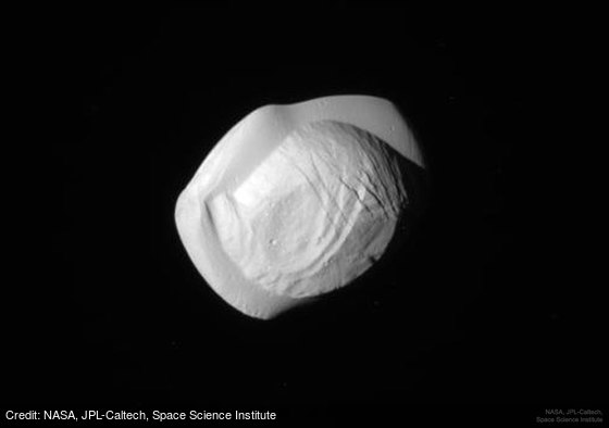 apod's tweet photo. Saturns Moon Pan from Cassini: https://t.co/LkhsNL7wdL by NASA, @NASAJPL, Space Science Institute https://t.co/oCmcmhKq9u