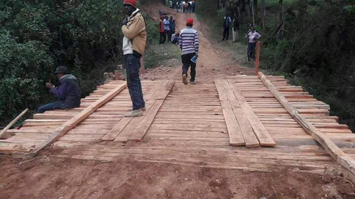 droid254's tweet photo. Some politician flew a chopper to go launch a wooden bridge 😑😑😭😭😭😭 https://t.co/PU4449YfAm