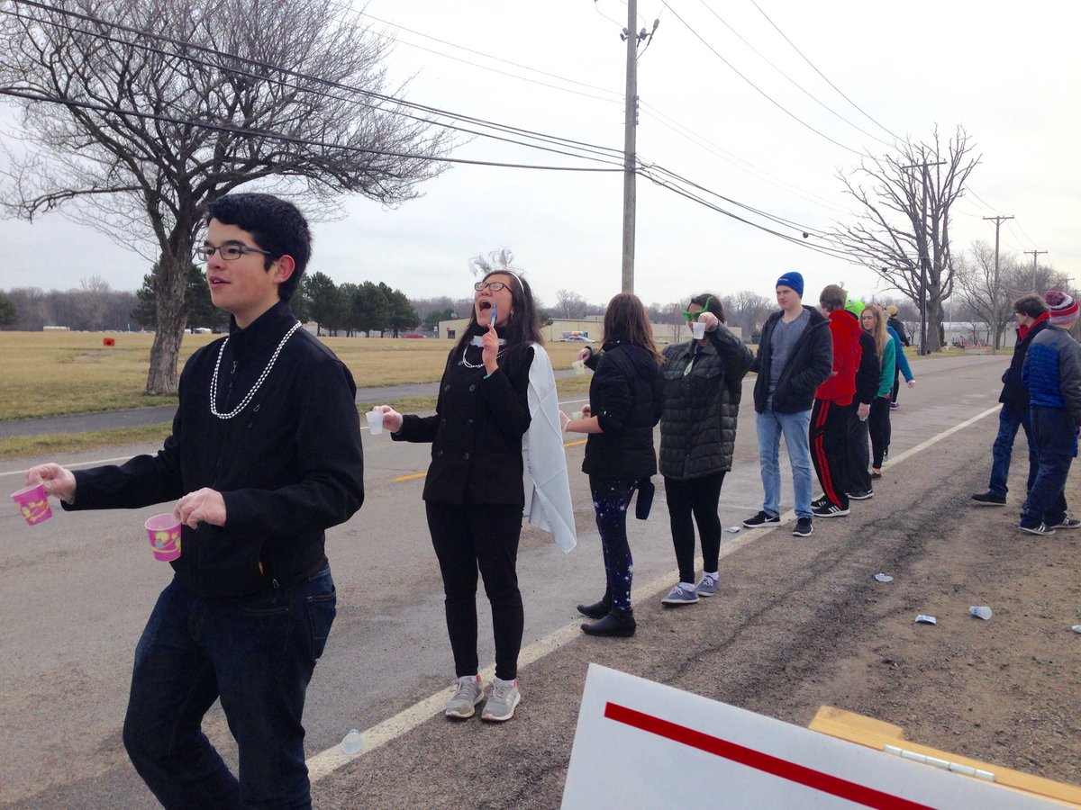 Cheering on and passing out water and energy drinks to runners at the Rock CF Half Marathon! This is how we put our community #FIRST. 🏃