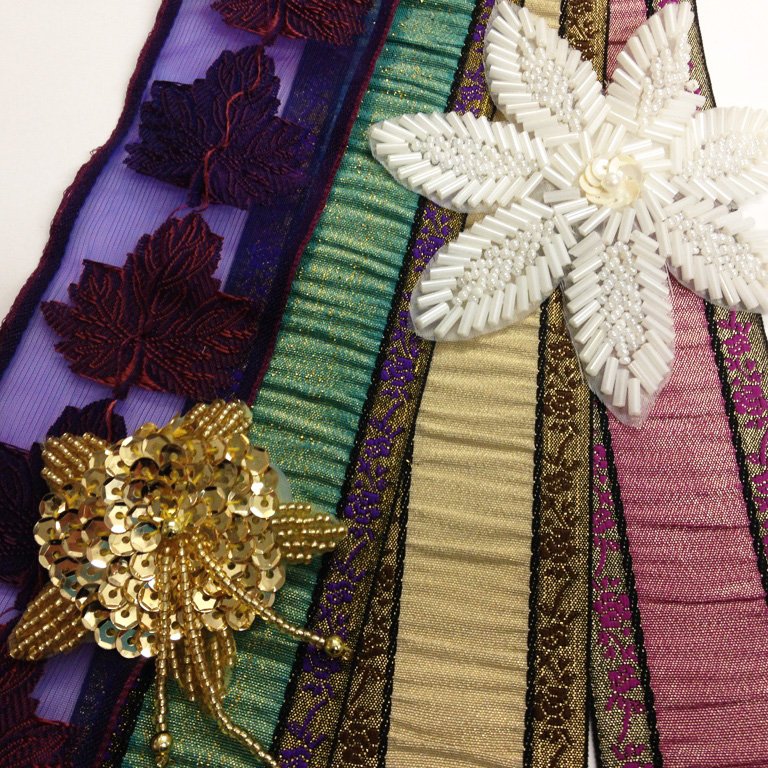 We love the vintage yet vibrant feel of these trims and beaded motifs, just a small selection from our vast collection of trimmings.