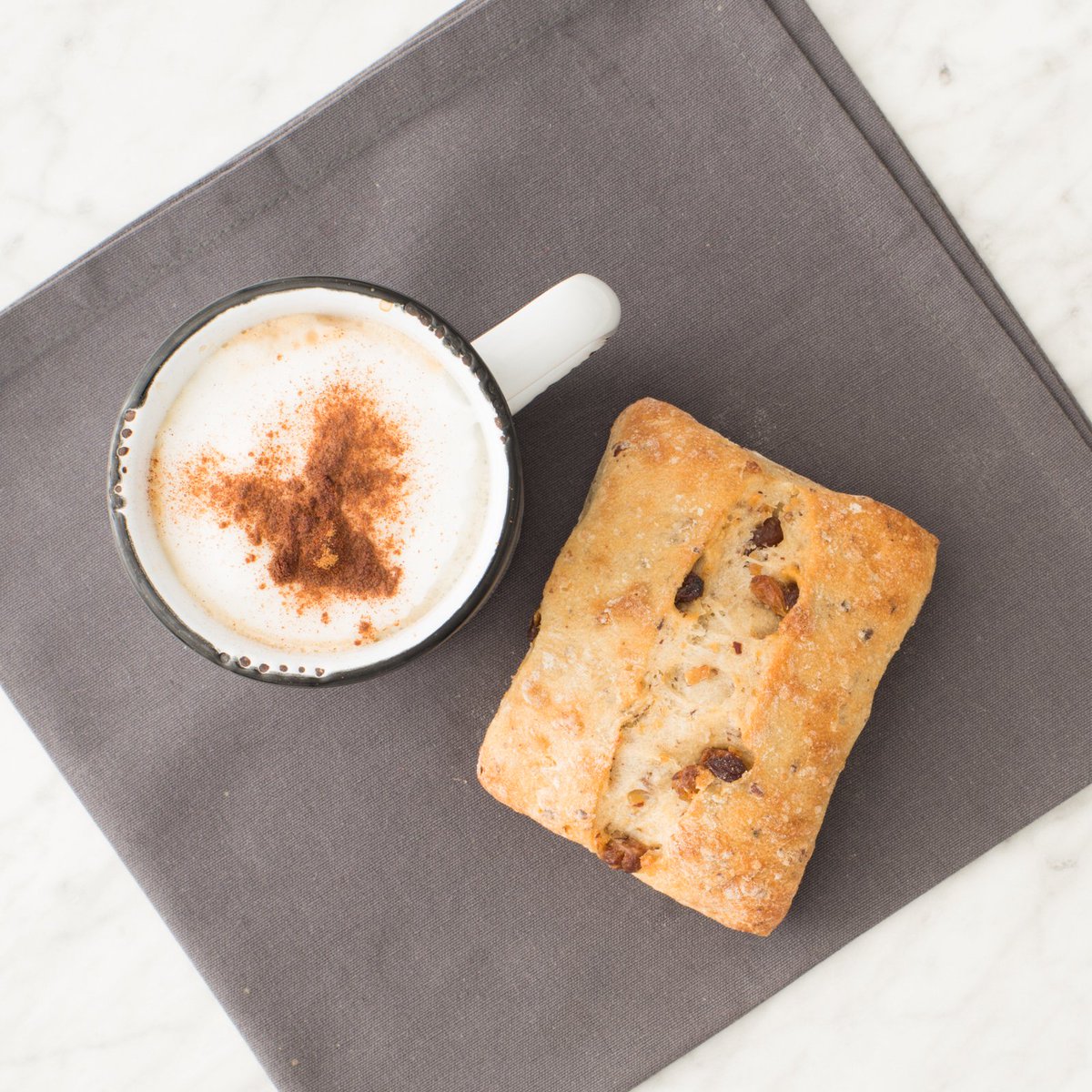 Paired with a DIY latte, our Raisin and Hazelnut Bun makes for a top-notch, grab-and-go #breakfast!