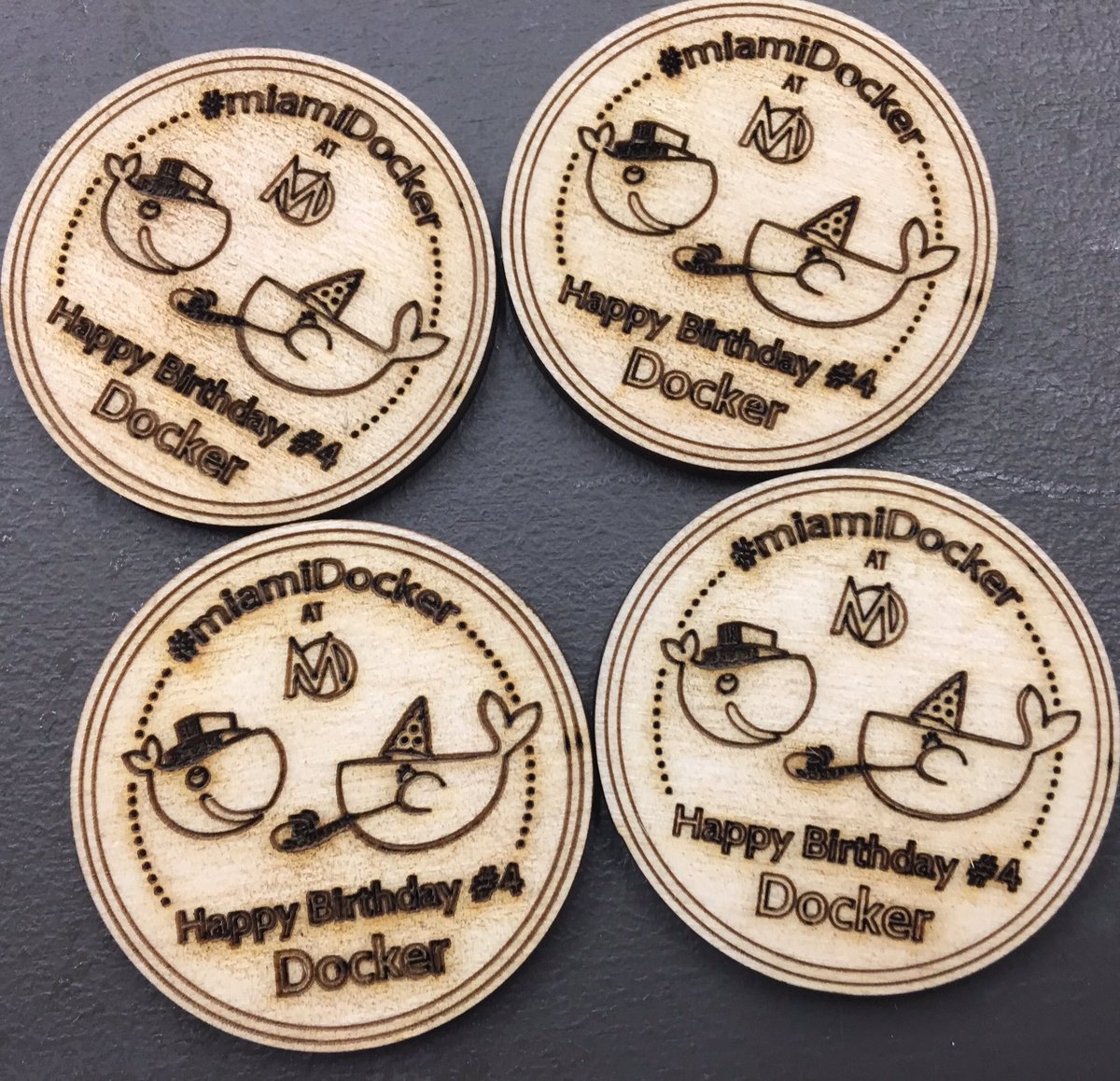 mariocruz's tweet photo. I made special #dockerbirthday badges for all #Miamidocker attendees that completed labs. #miamitech #makeitatmoonlighter #laserCutter https://t.co/viDUHqSuTU