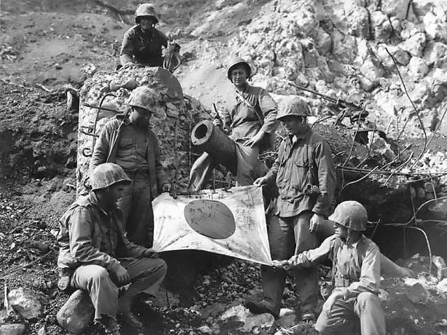 After a month of combat, US troops have eliminated organised Japanese resistance on island of Iwo Jima, with over 18,000 defenders dead.