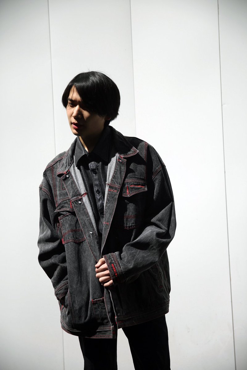 black denim jacket with red stitching